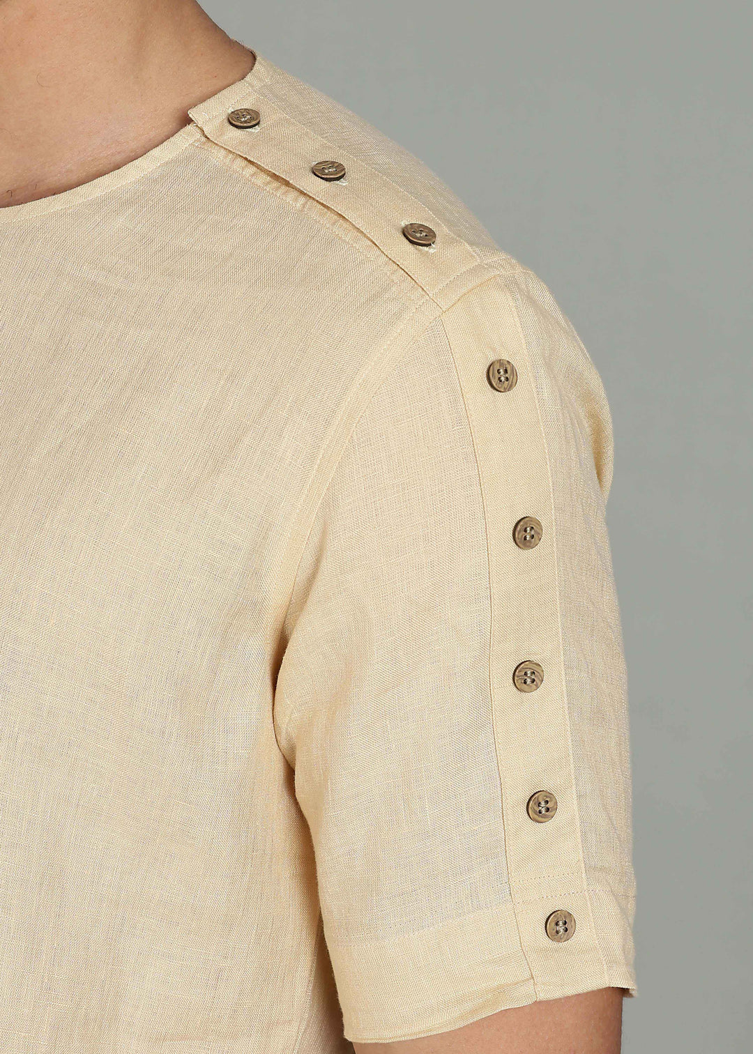 Man wearing 100% 60 LEA Light Tea Yellow Mandarin collar  T - Shirt in an indoor grey background.