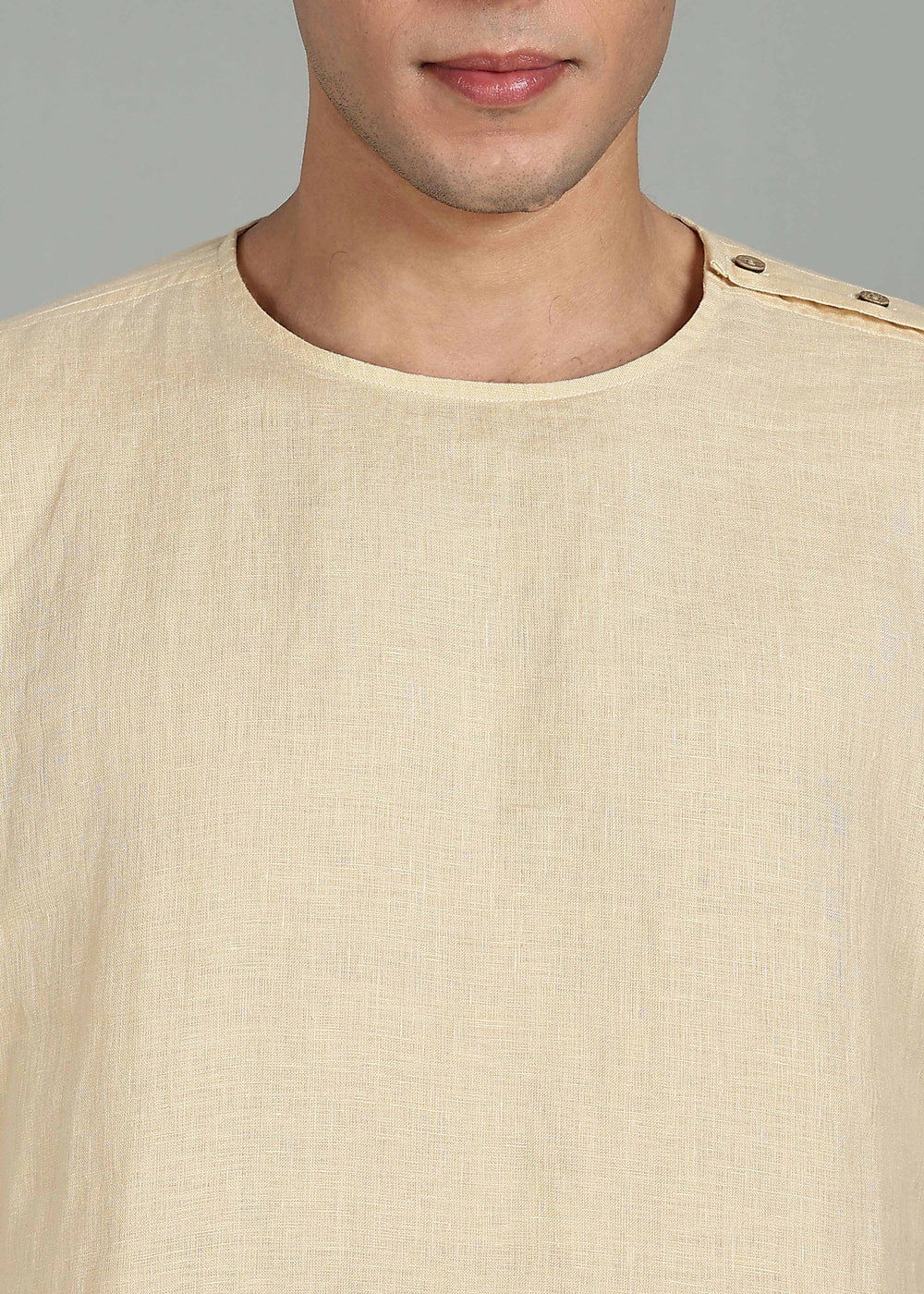 Man wearing 100% 60 LEA Light Tea Yellow Mandarin collar  T - Shirt in an indoor grey background.