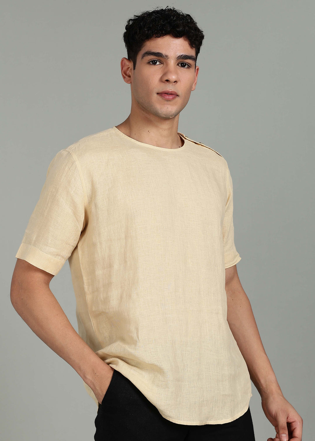 Man wearing 100% 60 LEA Light Tea Yellow Mandarin collar  T - Shirt in an indoor grey background.