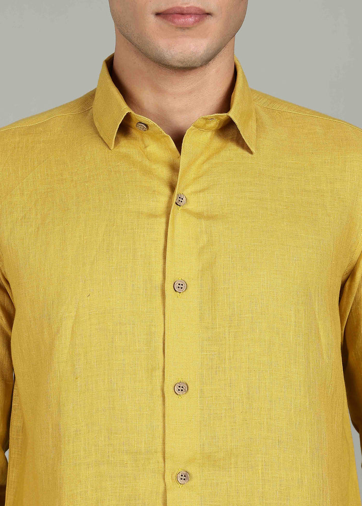 a 100% pure linen sunburst yellow full sleeve shirt in 60 LEA by a person on a gray background
