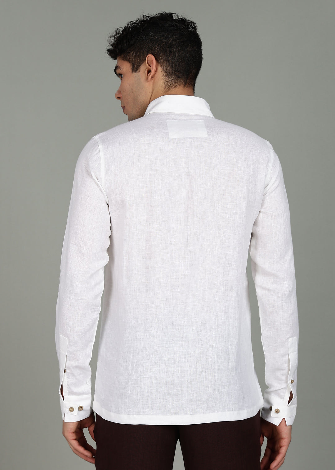 Man wearing a 100% pure linen White full sleeve shirt in 60 LEA against a gray background