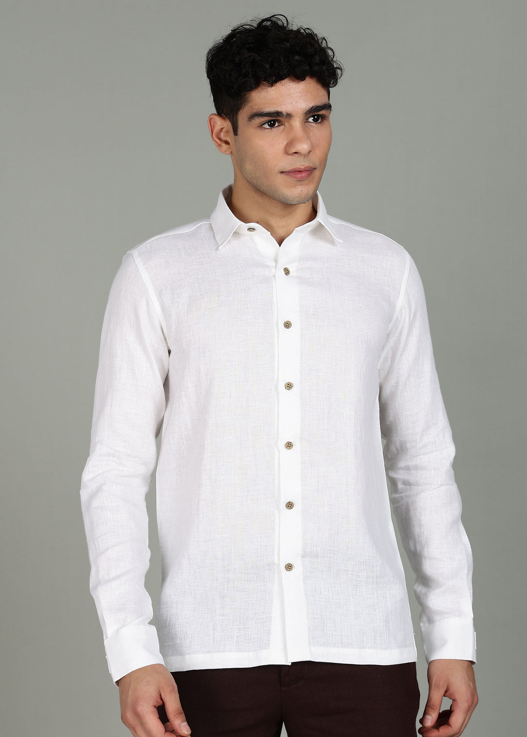 Man wearing a 100% pure linen White full sleeve shirt in 60 LEA against a gray background