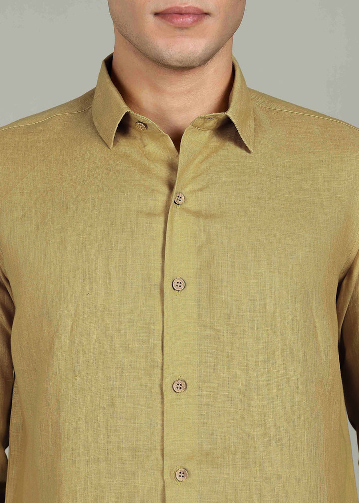 Man wearing a 100% pure linen sunburst yellow full sleeve shirt in 60 LEA against a gray background