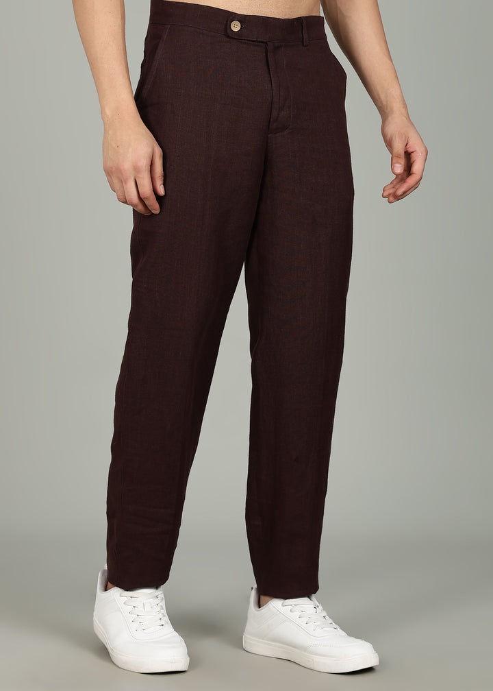 Man wearing 100% 25 LEA Cocoa Brown formal pants in an indoor grey background.