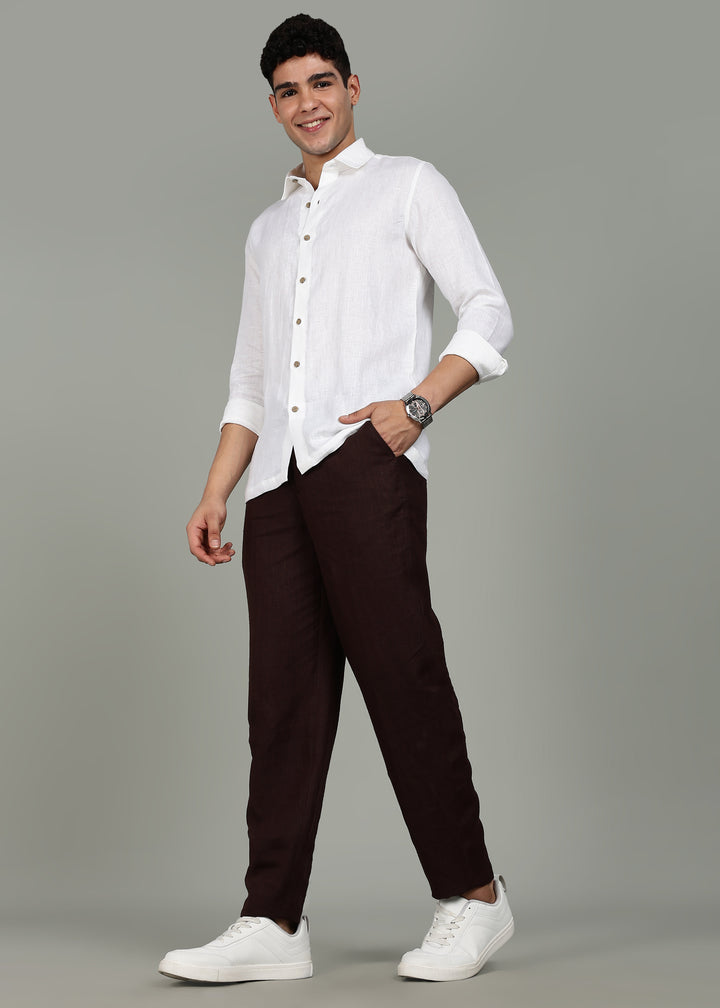 Man wearing 100% 25 LEA Cocoa Brown formal pants in an indoor grey background.