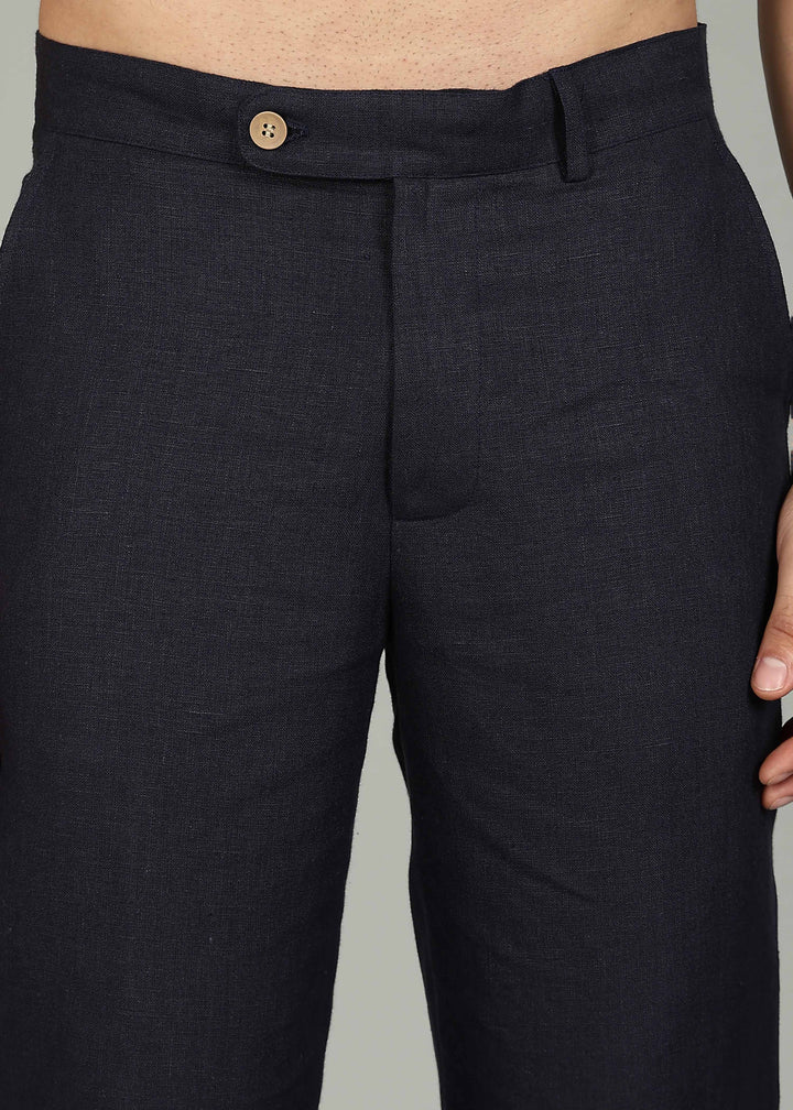 Man wearing 100% 25 LEA Regal Blue formal pants in an indoor grey background.
