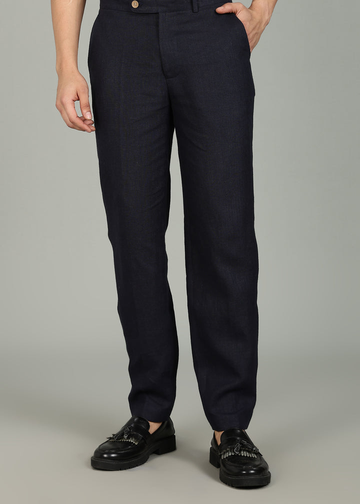 Man wearing 100% 25 LEA Regal Blue formal pants in an indoor grey background.