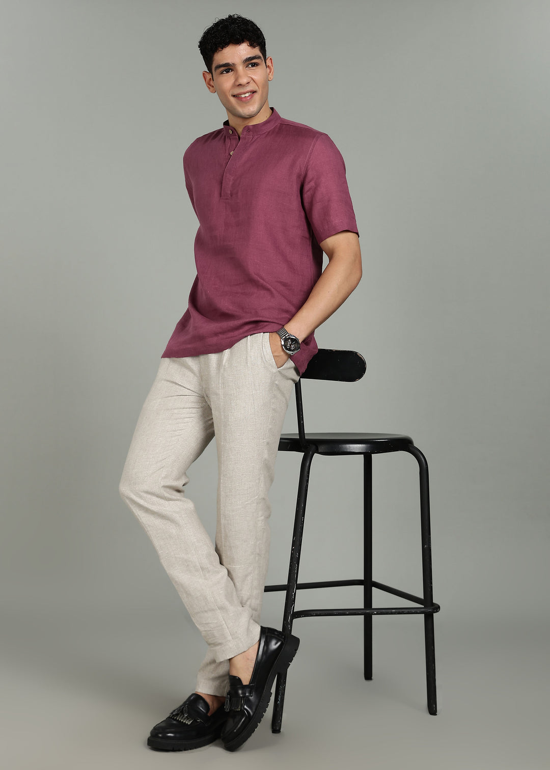 Man wearing 100% 60 LEA Twilight Purple  Half sleeve Shirt in an indoor grey background.