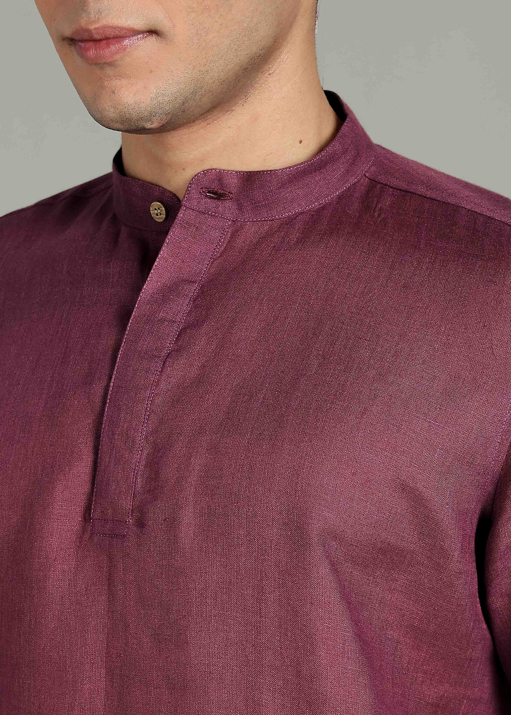 Man wearing 100% 60 LEA Twilight Purple  Half sleeve Shirt in an indoor grey background.