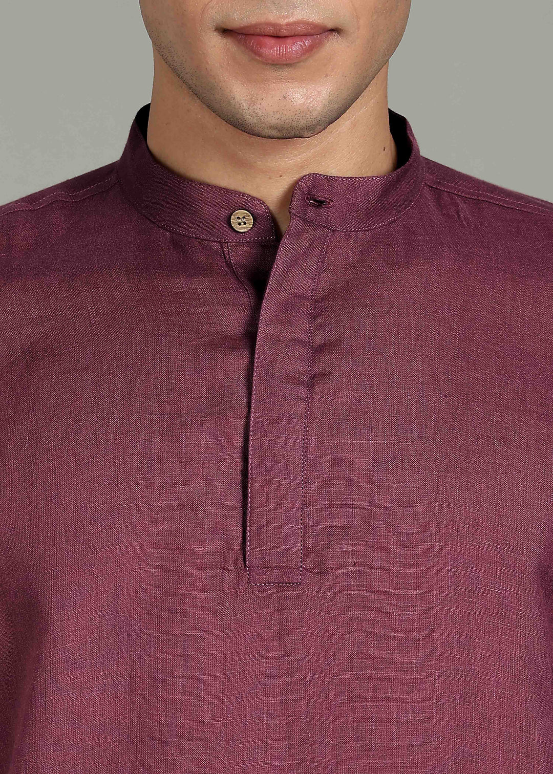Man wearing 100% 60 LEA Twilight Purple  Half sleeve Shirt in an indoor grey background.