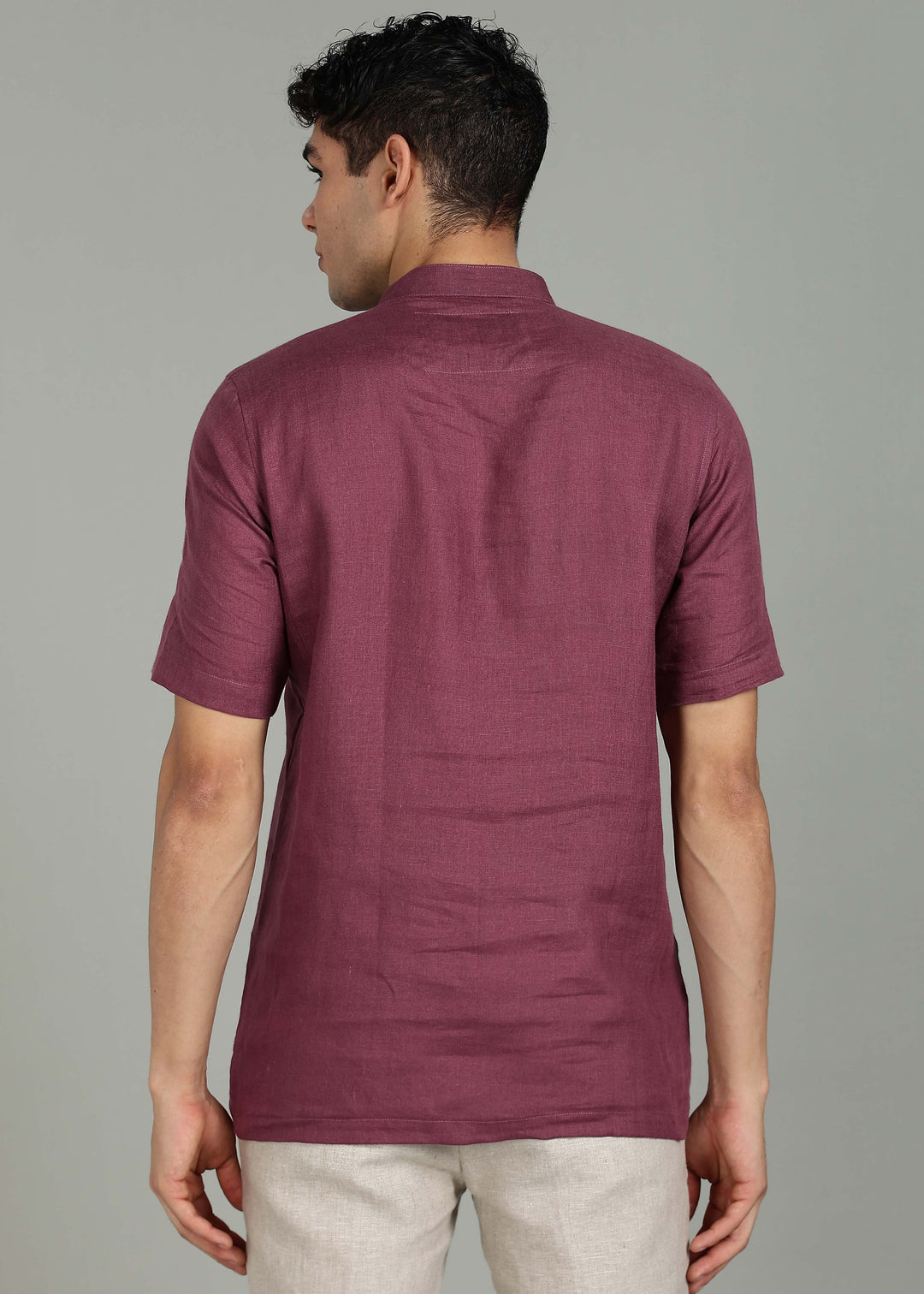 Man wearing 100% 60 LEA Twilight Purple  Half sleeve Shirt in an indoor grey background.
