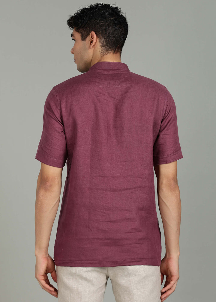 Man wearing 100% 60 LEA Twilight Purple  Half sleeve Shirt in an indoor grey background.