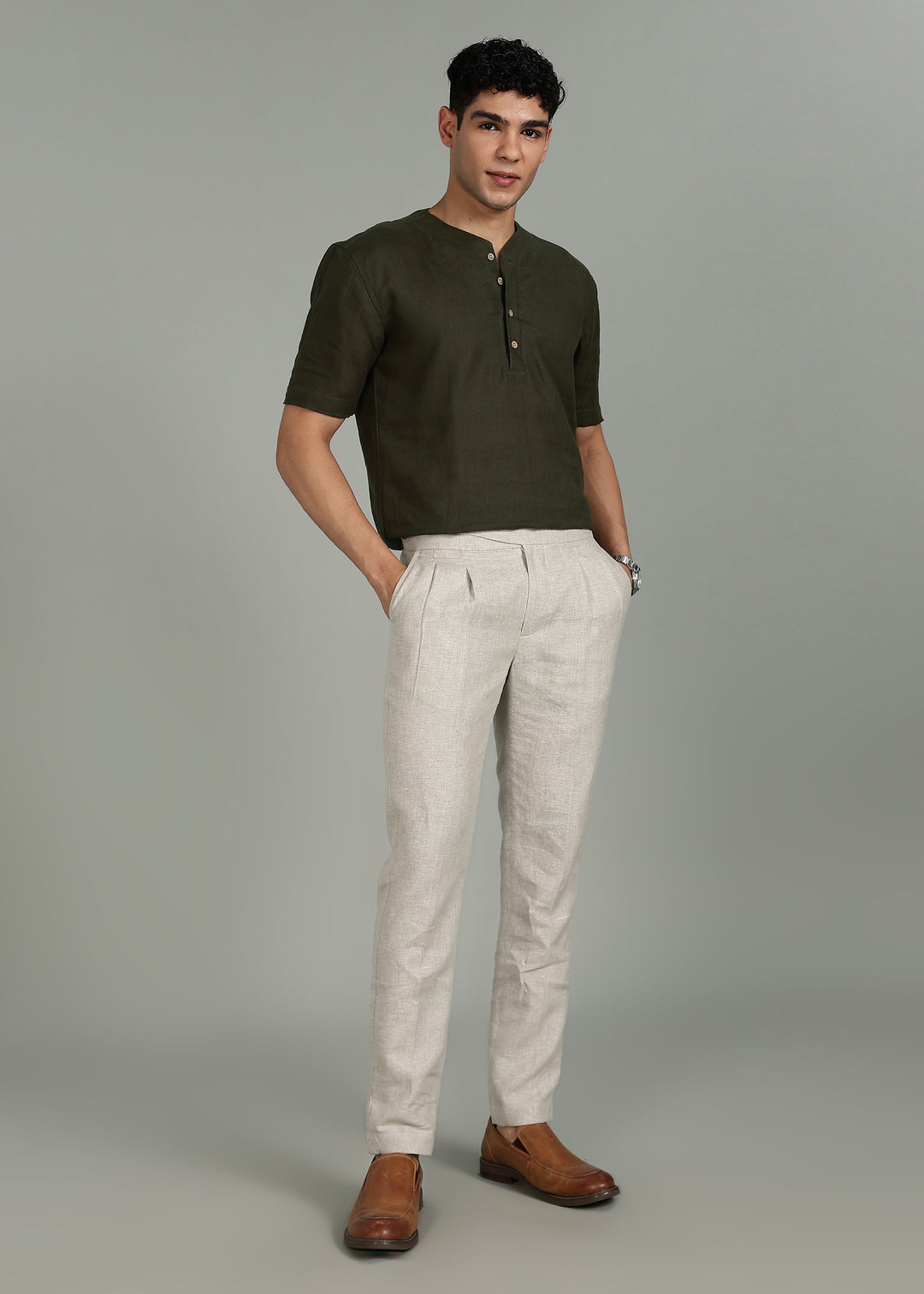 Man wearing 100% 60 LEA Moss Green Baseball collar T - Shirt in an indoor grey background.