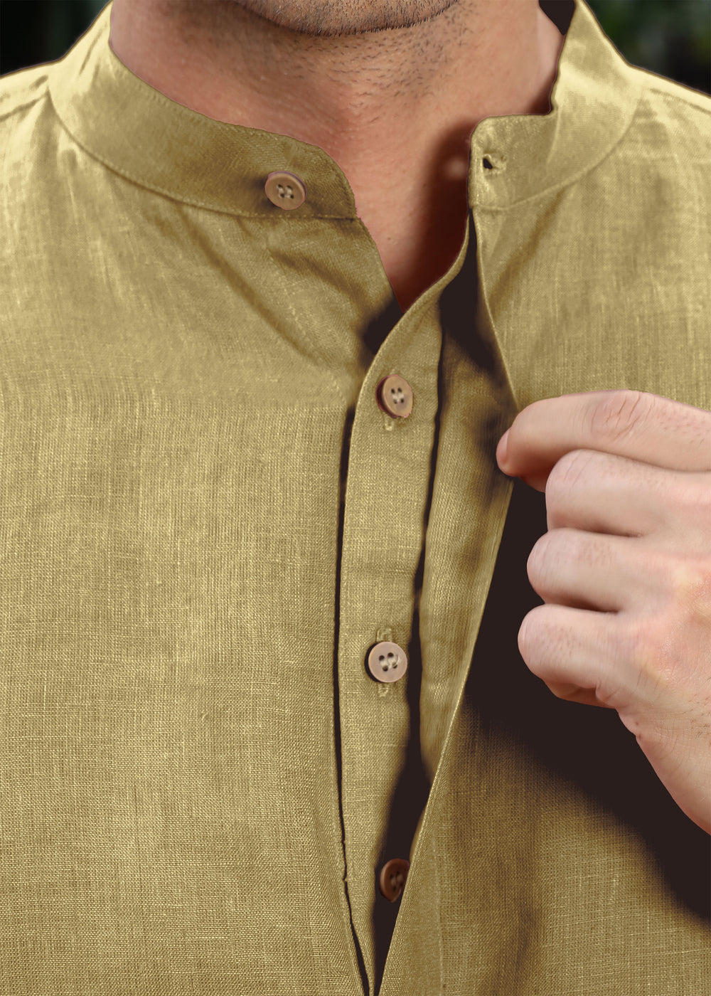 Man wearing a 100% pure linen 60 LEA sunburst yellow kurta against a green leafy background
