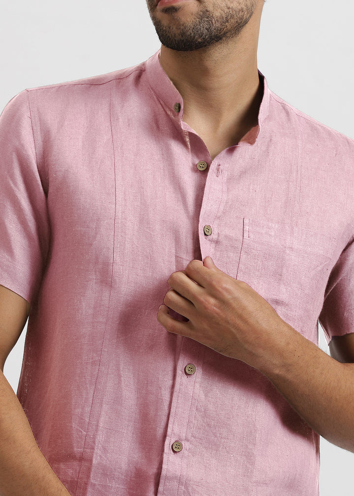 Man wearing a 100% pure linen hermosa pink shirt with a neutral background