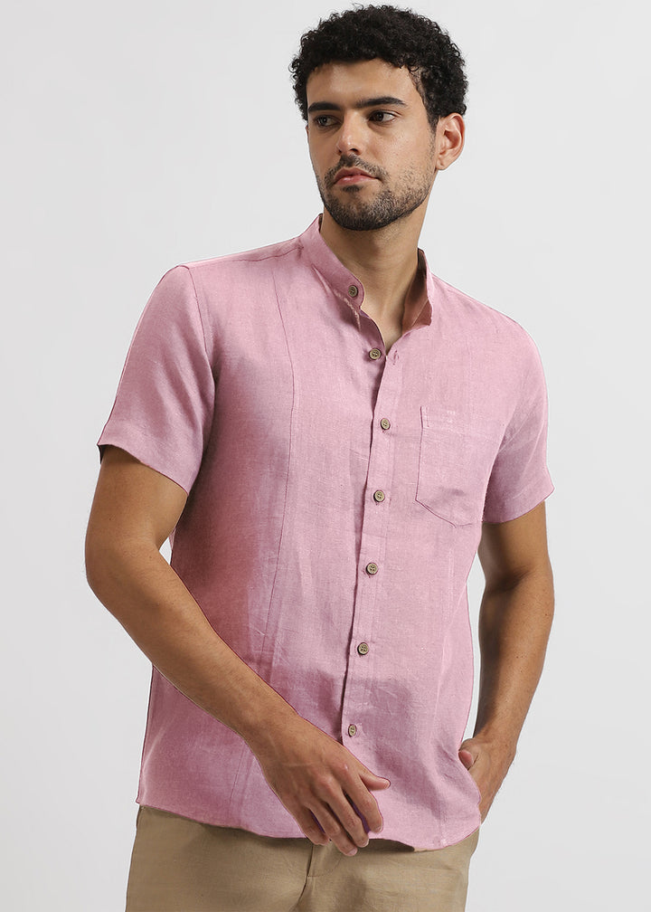 Man wearing a 100% pure linen hermosa pink shirt on a white background