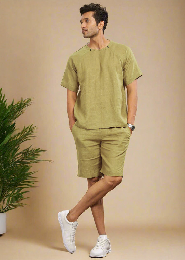 A pair of sunburst yellow pure linen shorts with an elastic band, displayed on a model