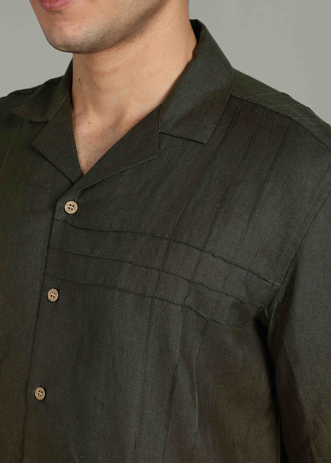 Man wearing 100% 60 LEA Moss Green Cuban collar Half sleeve Shirt in an indoor grey background.