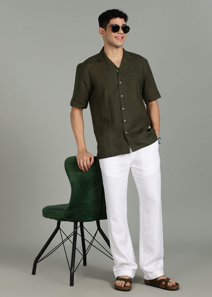 Man wearing 100% 60 LEA Moss Green Cuban collar Half sleeve Shirt in an indoor grey background.
