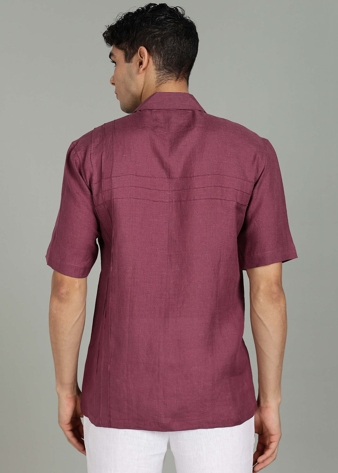 Man wearing 100% 60 LEA Twilight Purple Cuban collar Half sleeve Shirt in an indoor grey background.