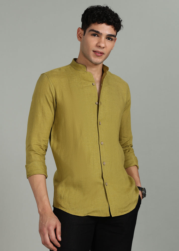 Man wearing a 100% pure linen sap green full sleeve shirt in 60 LEA against a gray background