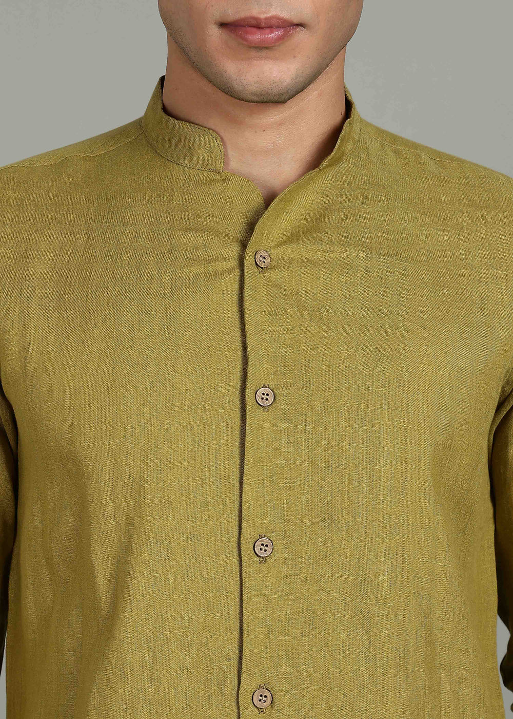 100% pure linen sap green full sleeve shirt in 60 LEA with button details on a plain background