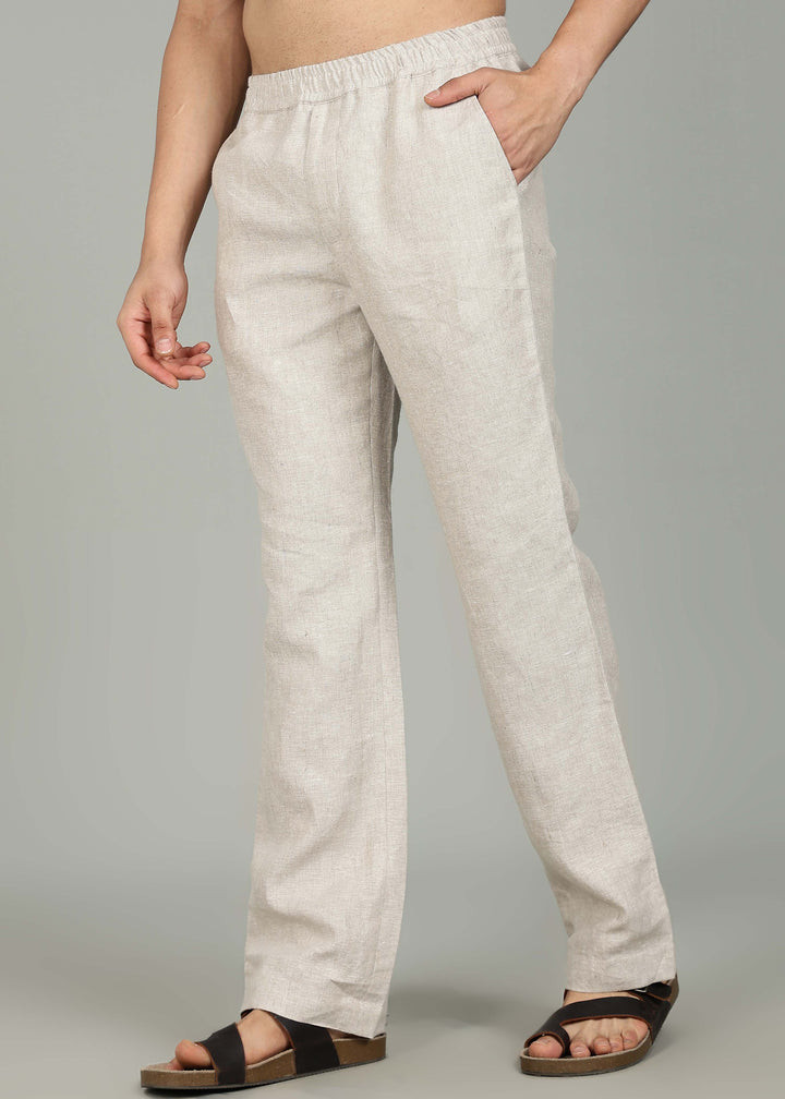 100% pure linen ecru pants in 25 LEA worn by a person on a gray background