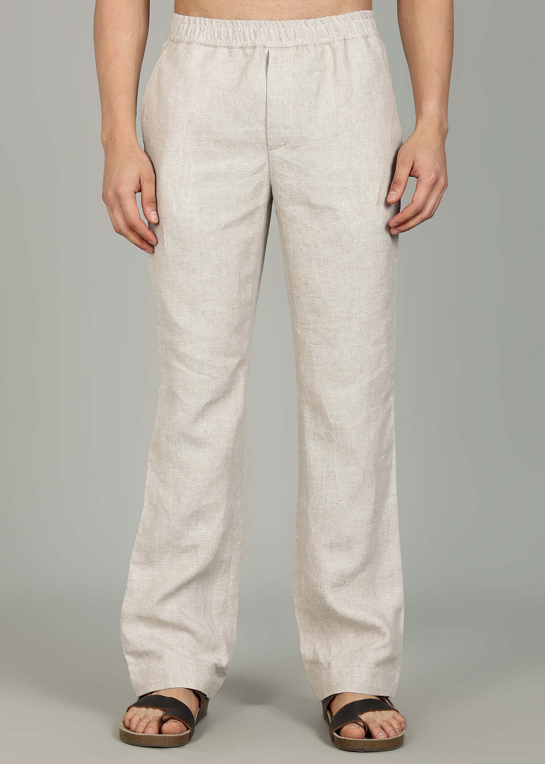 100% pure linen ecru pants in 25 LEA worn by a person on a gray background