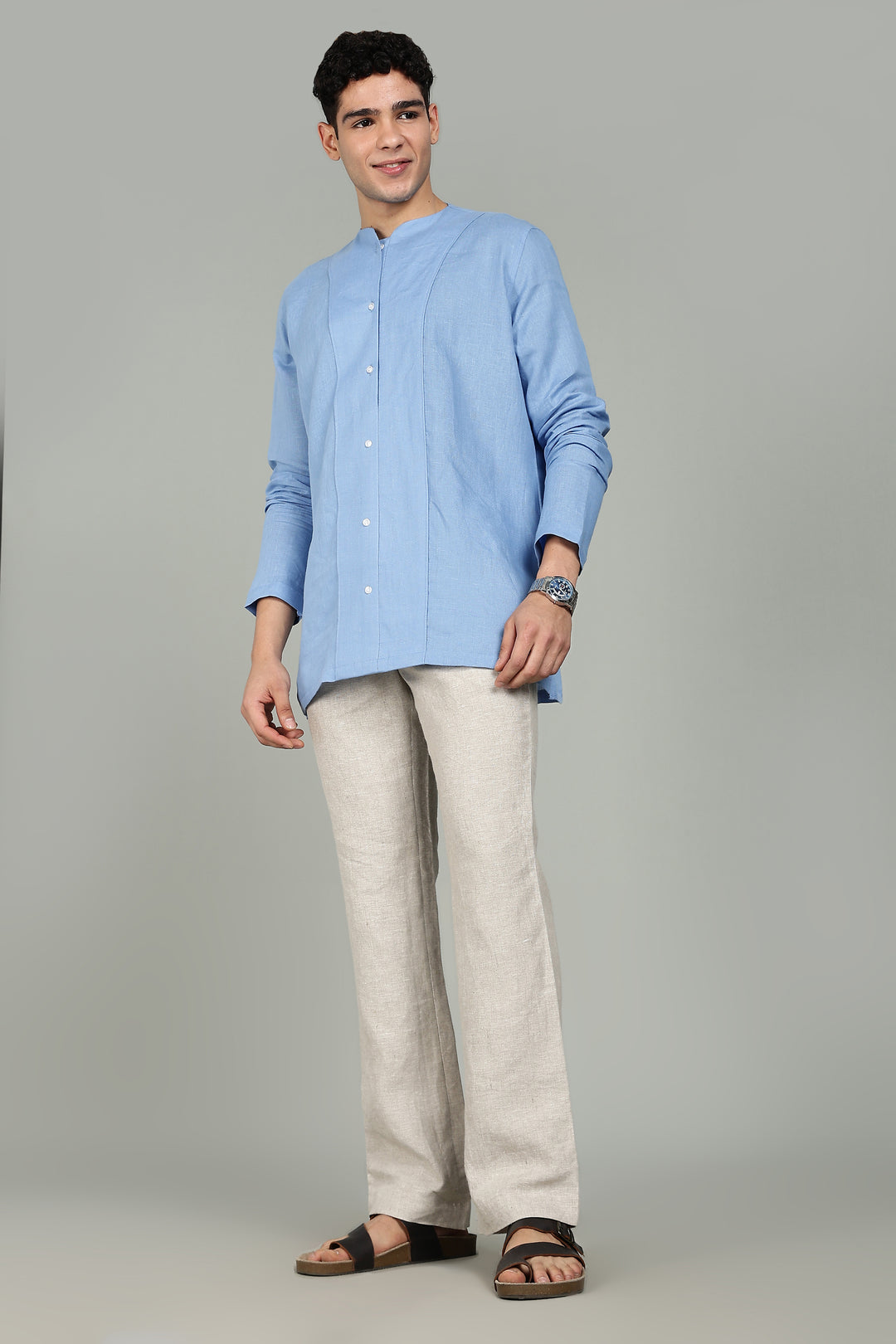 100% pure linen ecru pants in 25 LEA worn by a person on a gray background
