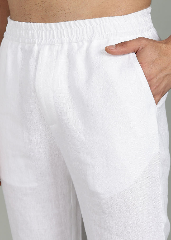 100% pure linen white pants in 25 LEA worn by a person on a gray background