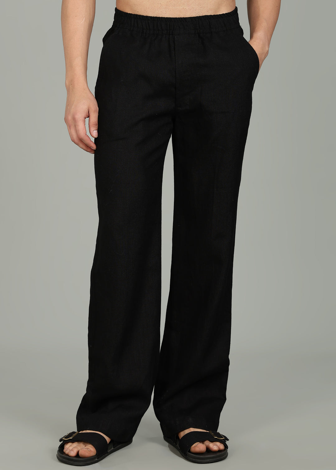 100% pure linen black pants in 25 LEA worn by a person on a gray background