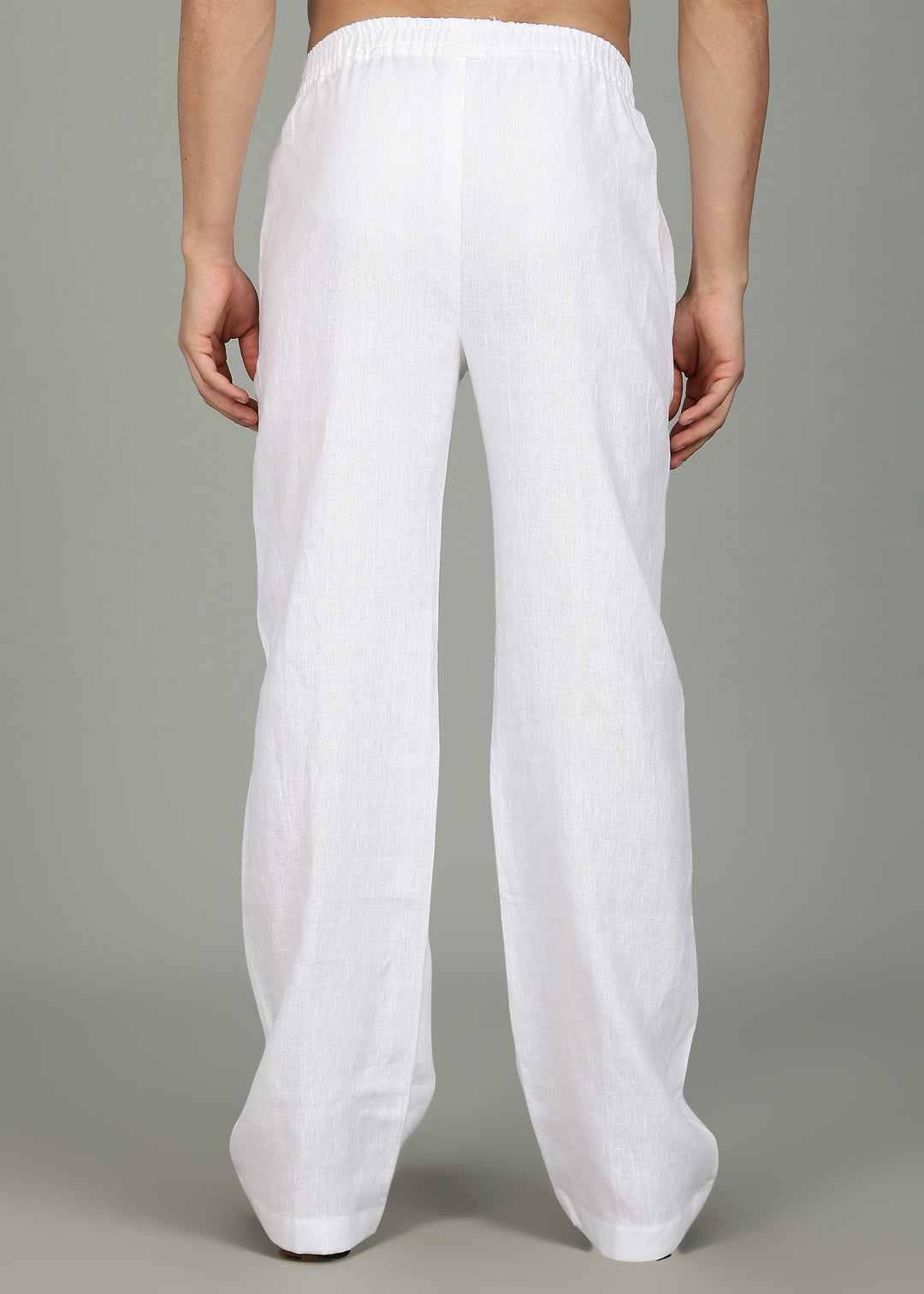100% pure linen white pants in 25 LEA worn by a person on a gray background